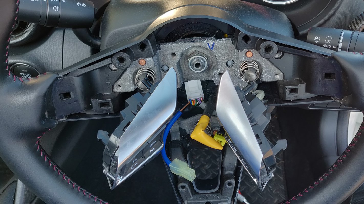 A close up of the sterring wheel controls